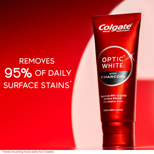 Colgate Optic White toothpaste tube with red background