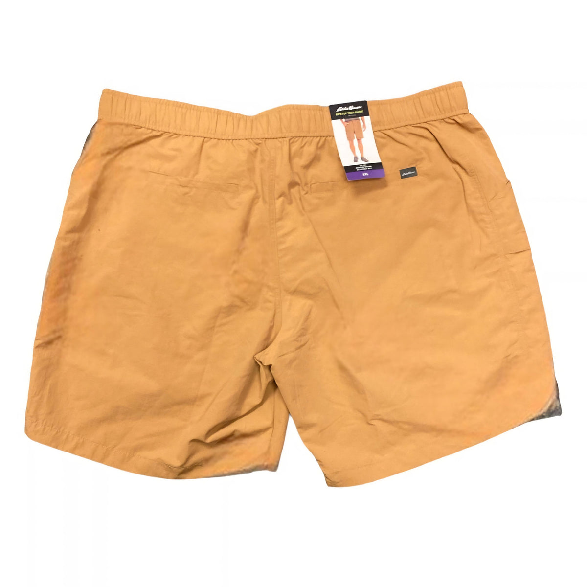 A pair of men's casual shorts in a warm mustard yellow color, shown flat against a white background with a retail hangtag attached at the waistband.
