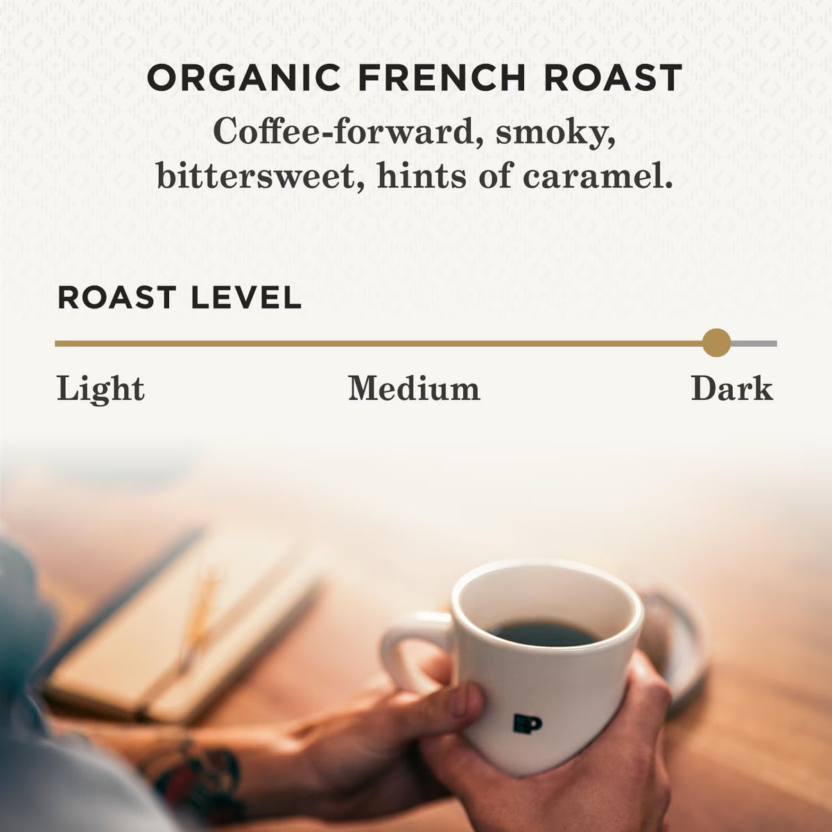 Person holding a coffee cup with text about organic French roast coffee.