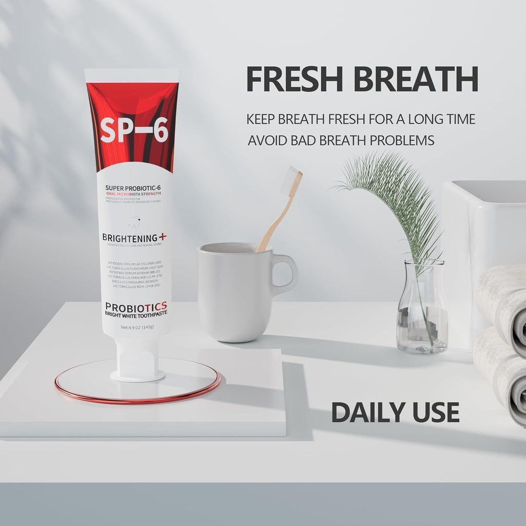 SP-6 Probiotic Toothpaste tube displayed on a bathroom vanity with mug and toothbrush highlighting fresh breath