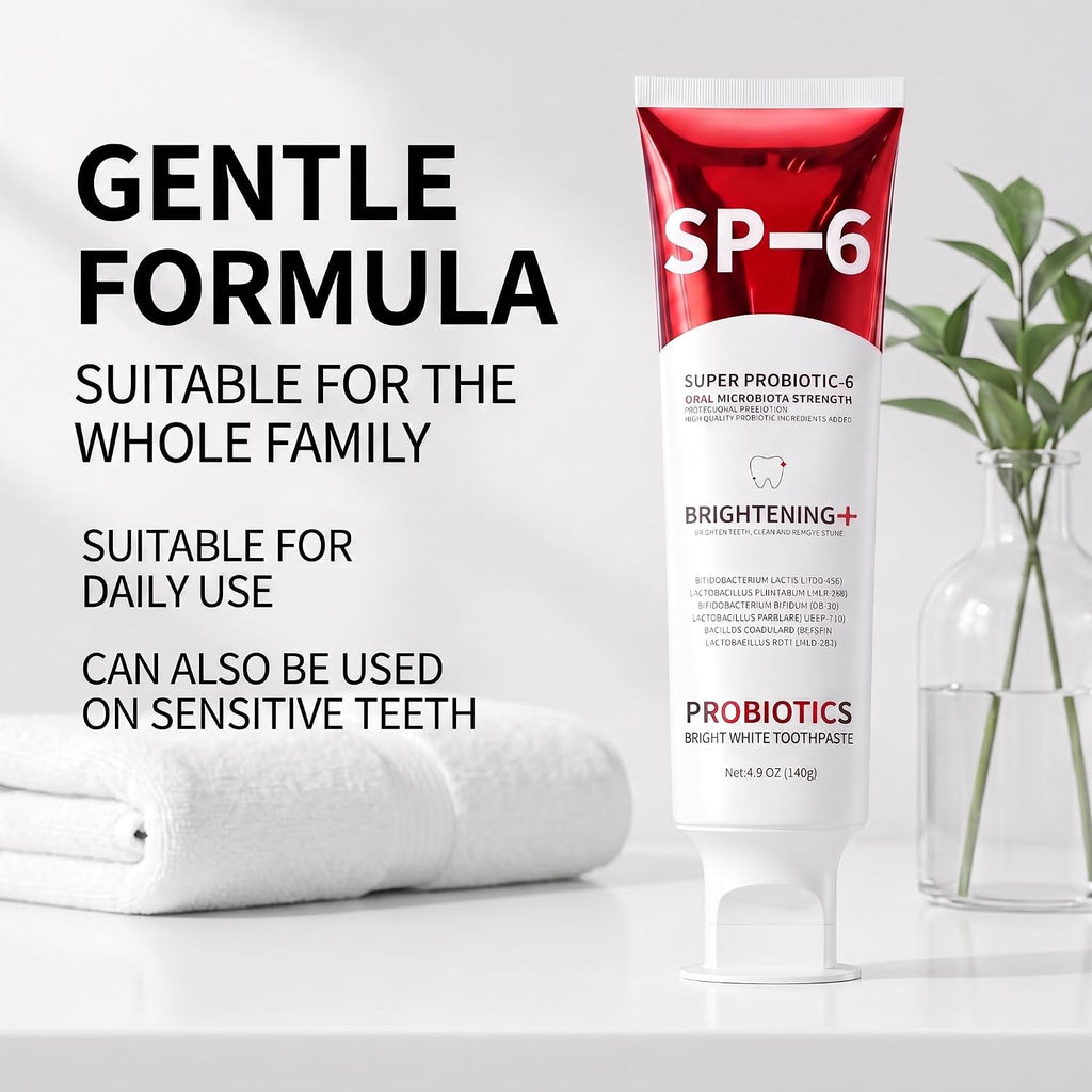 SP-6 Probiotic Toothpaste tube standing next to folded white towels highlighting sensitive teeth safety