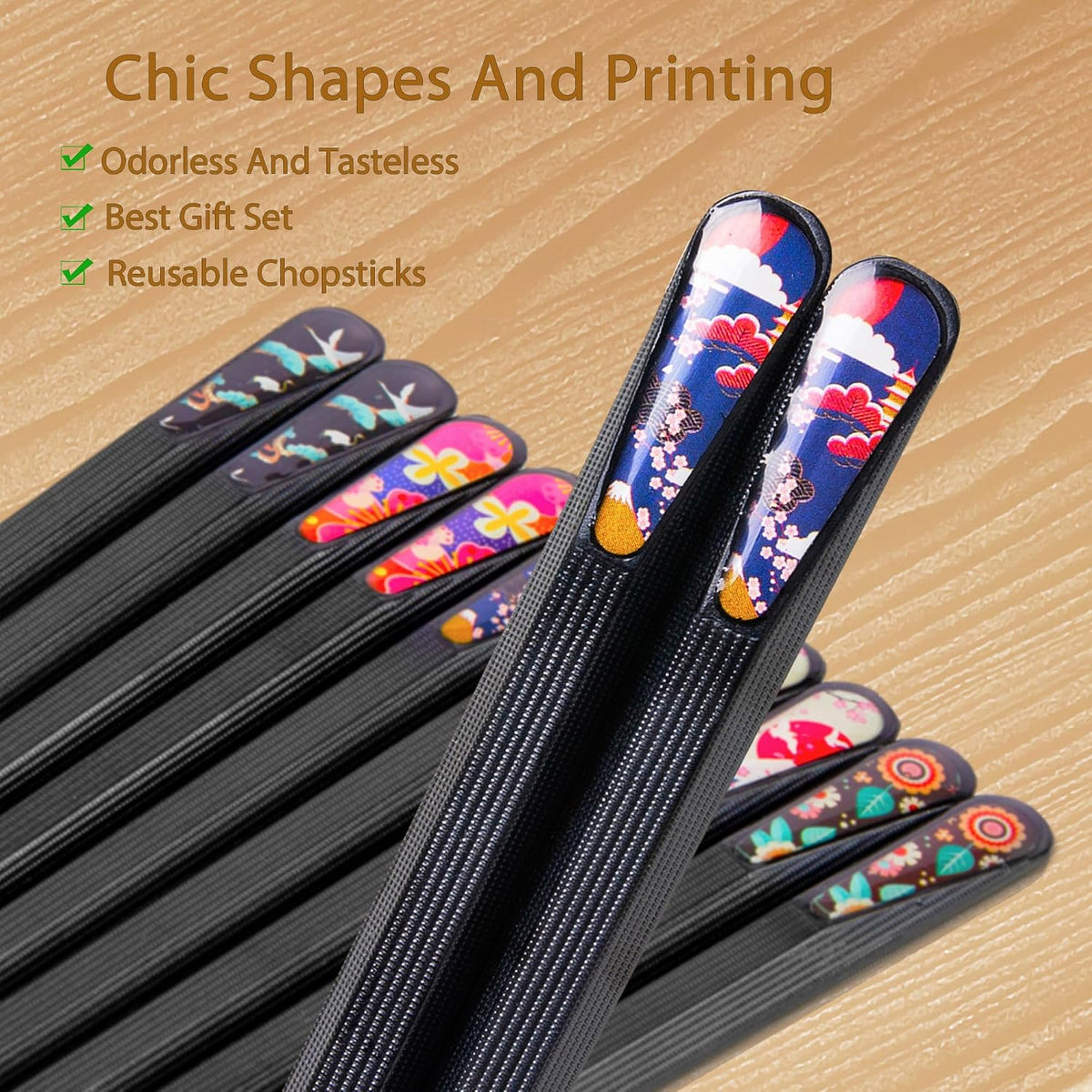 Reusable chopsticks with colorful designs on a wooden surface
