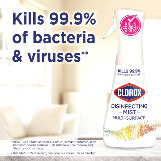 Clorox disinfecting mist multi-surface cleaner bottle with text on a blurred indoor background